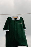 Forest green Dognosis polo shirt with white collar and cuffs